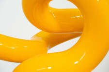 This minimalist metal outdoor sculpture in bright yellow was created by Canadian sculptor Alexander Caldwell. Image 9