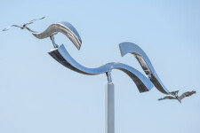 The graceful flight of two birds is captured in this stunningly elegant contemporary sculpture by Amos Robinson. Image 4