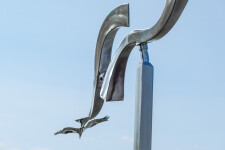 The graceful flight of two birds is captured in this stunningly elegant contemporary sculpture by Amos Robinson. Image 6