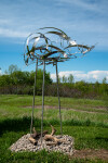 This contemporary outdoor sculpture is forged from stainless steel to resemble clouds. Image 2