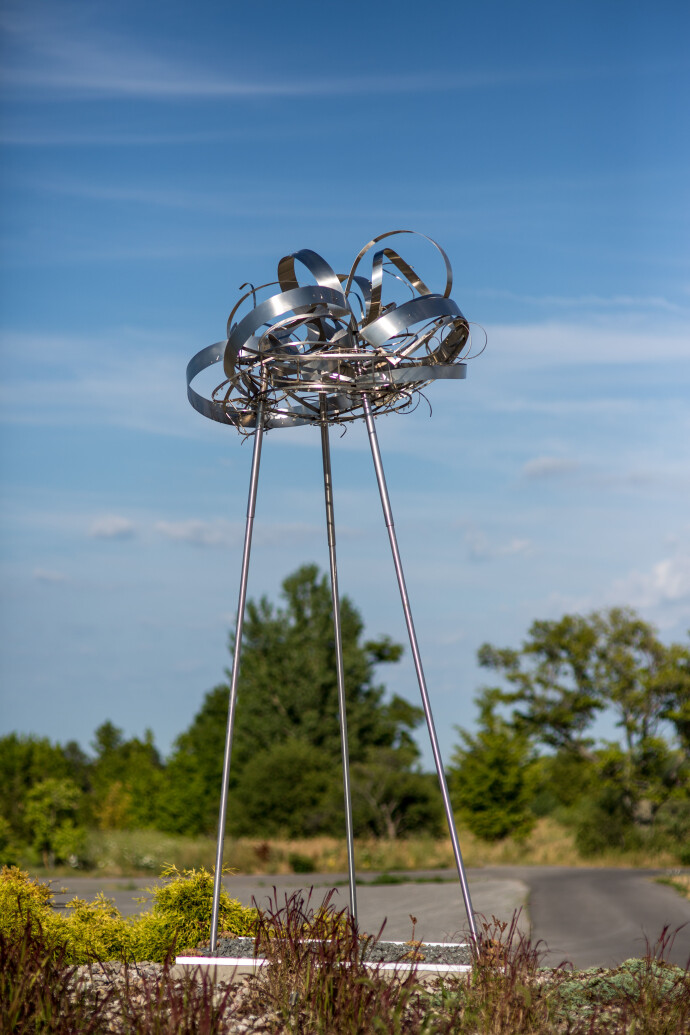 Ania Biczysko’s ethereal sculpture is made of stainless-steel strips and ribbons adorned with crystals, suspended in a cloudlike formation.