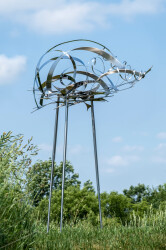 This contemporary outdoor sculpture is forged from stainless steel to resemble clouds.