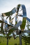 In this elegant sculpture by Ania Biczysko, fine ribbons of stainless-steel overlap in circles forming a cloud-like structure mounted on a t… Image 6