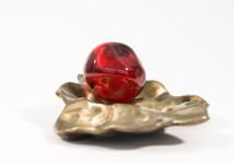 Luscious pomegranate red glass nesting in a bronze casing. Image 3