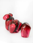 Clustered and sensuous oblong forms in translucent red glass have a smooth polished surface like the fruit that surrounds pomegranate seeds. Image 5