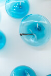 This contemporary glass wall sculpture in a captivating turquoise blue was created by an award-winning artist. Image 7