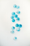 This contemporary glass wall sculpture in a captivating turquoise blue was created by an award-winning artist. Image 3