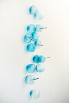 This contemporary glass wall sculpture in a captivating turquoise blue was created by an award-winning artist. Image 2