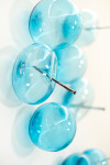 This contemporary glass wall sculpture in a captivating turquoise blue was created by an award-winning artist. Image 6