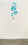 This contemporary glass wall sculpture in a captivating turquoise blue was created by an award-winning artist. Image 4