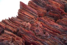 In this stunning piece by Canadian glass artist Cheryl Wilson-Smith, fine layers of red copper glass frit (ground glass) are layered in a mo… Image 4