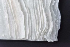 The delicate and intricate patterns formed by waves of icy waters is captured in this contemporary wall sculpture by Cheryl Wilson Smith. Image 6