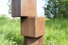 An elegantly curved column of corten steel appears to almost float in mid-air in this arresting outdoor sculpture by Claude Millette. Image 9