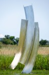 The graceful arc of a dancer in motion is emulated in the fluid form of this elegant sculpture by Claude Millette. Image 2