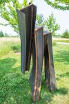 This striking blackened corten steel sculpture was created by Claude Millette. Image 5