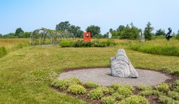 Concentric rings are carved on one side of this triangular chunk of limestone. Image 10