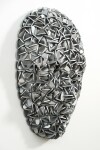 Forged from metal, this contemporary wall sculpture in a mask form is by Dale Dunning. Image 5