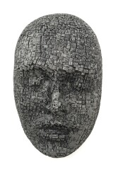 This contemporary metal wall sculpture is a mask.