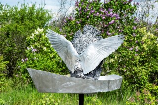 Old lead type, welded together to form the weathered face of this piece, is cast in aluminum.