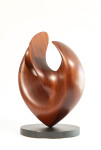 The graceful curves of this contemporary solid mahogany sculpture by David Chamberlain appear to emulate the image of a heart. Image 9