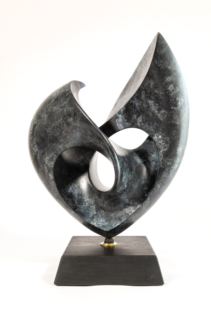 This contemporary bronze sculpture inspired by music is shaped like a heart and was made by David Chamberlain.