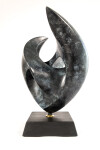 This contemporary bronze sculpture inspired by music is shaped like a heart and was made by David Chamberlain. Image 2