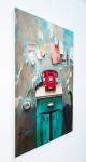 A bright red rotary phone sits on a turquoise-green cabinet, paper notes randomly taped to the wall, paint-peeling in this nostalgic trompe … Image 2