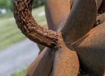 Hand forged from weathering steel Floyd Elzinga’s impressive outdoor sculpture of a pine cone is designed to house logs for a fire. Image 7