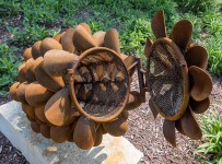 Hand forged from weathering steel Floyd Elzinga’s impressive outdoor sculpture of a pine cone is designed to house logs for a fire. Image 8