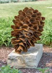 Hand forged from weathering steel Floyd Elzinga’s impressive outdoor sculpture of a pine cone is designed to house logs for a fire. Image 3