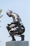 This figurative bronze and stainless steel outdoor sculpture of a female was created by a Canadian artist. Image 4