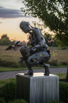 This figurative bronze and stainless steel outdoor sculpture of a female was created by a Canadian artist. Image 9