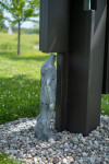 This contemporary outdoor sculpture was forged from steel in a figurative and geometric form. Image 2