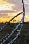 Canadian artist Jake Goertzen creates a symmetrical design with six stainless steel rings in this elegant outdoor sculpture. Image 8