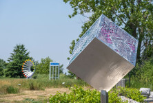 A stainless-steel cube is laser cut on three sides with the outline of a digital circuit board in this intriguing outdoor sculpture by Jake … Image 10