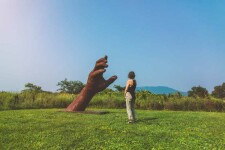 A massive hand appears to rise out of the earth in this engaging sculpture by Mississippi artist, Jason Kimes. Image 7