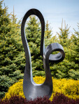 Smooth black granite engineered to resemble a time signature in music becomes an elegant outdoor sculpture by artist Jeremy Guy. Image 2