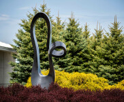 Smooth black granite engineered to resemble a time signature in music becomes an elegant outdoor sculpture by artist Jeremy Guy. Image 6