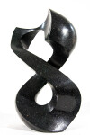 Smooth-surfaced, engineered black granite is sculpted into an elegant figure eight by Jeremy Guy. Image 3