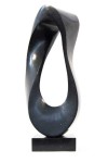 Smooth surfaced, black granite flecked almost imperceptibly with copper and white has been engineered into an elegant mobius strip by sculpt… Image 5