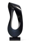 Smooth surfaced, black granite flecked almost imperceptibly with copper and white has been engineered into an elegant mobius strip by sculpt… Image 2