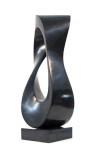 Smooth surfaced, black granite flecked almost imperceptibly with copper and white has been engineered into an elegant mobius strip by sculpt… Image 4