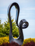 Smooth black granite engineered to resemble a time signature in music becomes an elegant outdoor sculpture by artist Jeremy Guy. Image 3