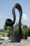 Smooth black granite engineered to resemble a time signature in music becomes an elegant outdoor sculpture by artist Jeremy Guy. Image 4