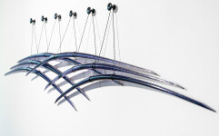 Canadian artist John Paul Robinson has chosen a deep blue for this elegant glass wall sculpture. Image 2