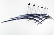 Canadian artist John Paul Robinson has chosen a deep blue for this elegant glass wall sculpture. Image 3