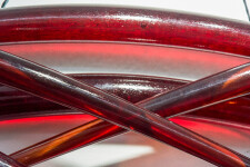 Arcs of glowing crimson glass are curated into elegant overlapping waves in this wall sculpture by John Paul Robinson. Image 10