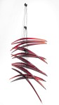 Elegantly curved deep red glass pieces in twos are suspended on fine black steel cables in this dramatic new wall sculpture by Canadian arti… Image 2