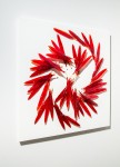 Crimson glass feathers are gathered into a fiery composition in this dramatic wall sculpture by artist John Paul Robinson. Image 4