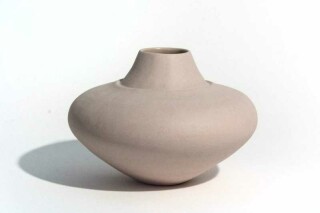 This stained pink stoneware vessel was hand crafted by ceramicist Loren Kaplan.